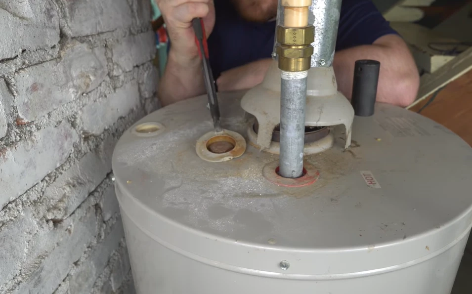 Residential tank water heater serviced during water heater repair in Opelika AL